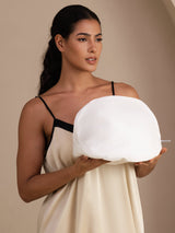 Woman holding a white mesh laundry wash bag for silk and delicate garments