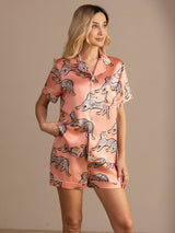 [Pink Cat] Peach pink cat-print short pajama set with contrast piping, waist-up view, model standing with one hand on the hip. 001