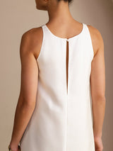 [White] Close back view of a mulberry silk sleeveless scoop-neck midi dress with gathered waist and side pockets in white 004