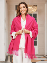 [Rose Red] rose red rectangular shawl with fringed edges, styled front view, wrapped at the neck with fringed ends down the front. 003
