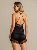 [Black] Rear studio view of a model wearing a black halter camisole and matching shorts with black lace trim. 002