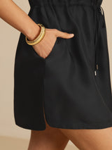 [Black] Side-pocket detail of a silk cap-sleeve short dress with drawstring waist and side pockets in black 005