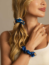 [Navy Dragon] Blue mulberry silk scrunchies holding blonde hair in a low ponytail and on wrist 005