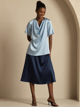 [Grayish Blue] Woman wearing light blue silk cowl neck short sleeve top with navy skirt 007