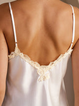 [Pink] Close back view of a pale blush pink mulberry silk camisole with spaghetti straps and floral lace along the V neckline 005
