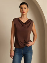 [Coffee] Coffee-brown cowl-neck top with blue jeans appears in a front mid-length crop, with one arm bent beside the torso. 001