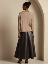 [Tan] Full rear view of a beige cardigan and dark brown maxi skirt, showing the straight back and flared hem. 007