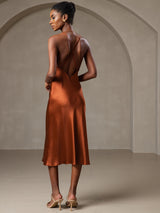 [Caramel] Back view of caramel silk midi dress with criss-cross straps 002