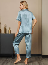 [Steel Blue] Full-length back view of silk pajamas with short-sleeve notch-collar top and ankle pants in steel blue with pale piping 002