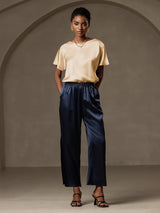 [Champagne] Model wearing champagne silk short sleeve boat neck top with navy wide-leg pants 012