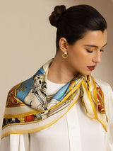 [P107] Close studio view of a square scarf with an ornate multicolor architectural print and gold border. 003