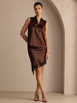 [Coffee] Three-quarter full-body front studio view of a model wearing coffee brown asymmetrical lace-hem skirt. 007