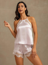 [Lavender] Lavender halter camisole and shorts with white lace trim in a front crop to thighs, one hand lifted beside the body. 004