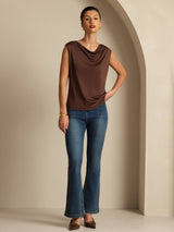 [Coffee] Full-body frontal view: coffee-brown sleeveless cowl-neck top with blue jeans, with the entire hem visible. 006