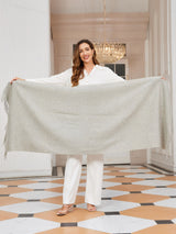 [Light Gray] Front view of the product held open: a rectangular wool shawl with fringed edges, 200 by 70 cm, in light gray 004