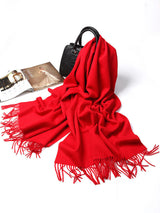 [Red] bright red rectangular shawl with fringed edges, flat lay, loosely draped beside a handbag and small accessories. 005