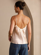 [Pink] Back waist-up view of a pale blush pink silk camisole with spaghetti straps and floral lace at the V neckline 002