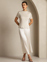 [Gray] Complete body view: light gray short-sleeve crew-neck top with a white skirt, with weight shifted sideways. 007
