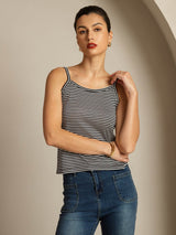 Black and white striped silk camisole top with spaghetti straps and square neckline on model