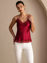 [Wine] Wine red lace-trim V-neck camisole top on a model in a mid-length front view with one hand lifted near the neckline. 003