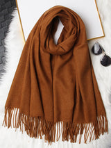 [Brown] warm brown rectangular shawl with fringed edges, flat lay, loosely coiled to show the fringe and full color. 006