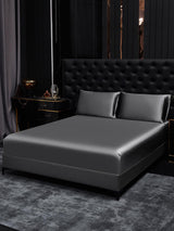 [Dark Gray] Dark gray silk fitted sheet with two matching pillowcases on a black luxury bed 001