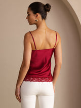 [Wine] Mid-length back studio view of a model wearing wine red lace-trim spaghetti-strap camisole. 002