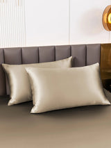 [Khaki] Two champagne mulberry silk pillowcases with envelope closure on a dark bed 001