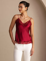 [Wine] Wine red lace-trim V-neck camisole top on a model in a mid-length front view with one hand at her hip and torso angled. 001