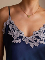 [Dark Blue] Neckline detail of a navy blue silk camisole with spaghetti straps and pale floral lace at the V neckline 005