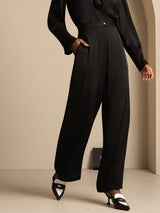 [Black] Complete frontal view: black high-rise wide-leg trousers with a black blouse, showing the overall cut and hem. 004