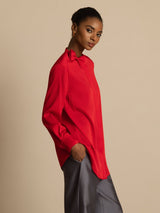 [Wine] Red long-sleeve collared blouse with gray wide-leg trousers in a front crop to mid-thigh, one hand tucked into a pocket. 006
