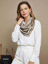 [P042] Woman wearing geometric pattern square silk scarf with white blouse and neutral tones 006